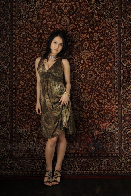 Japanese beauty Maria Ozawa models non nude in a dress and jewelry