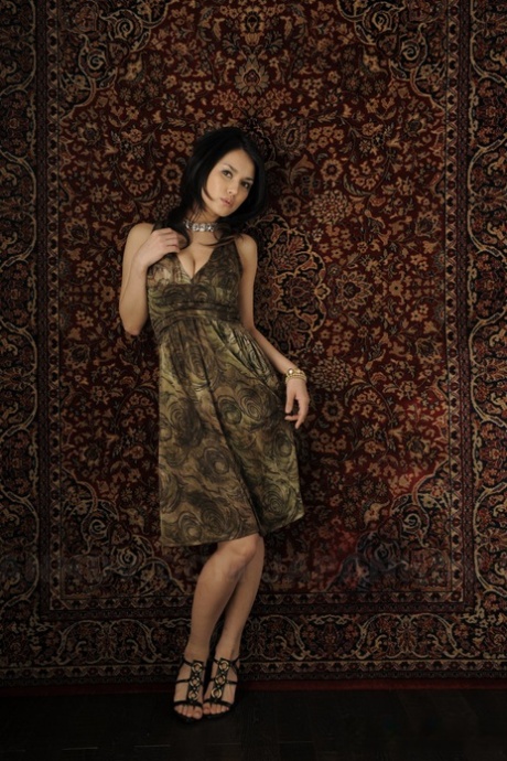 Japanese beauty Maria Ozawa models non nude in a dress and jewelry
