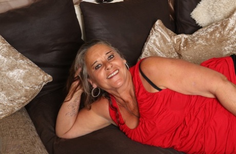 Older fatty masturbates on a sofa during candid action around her home