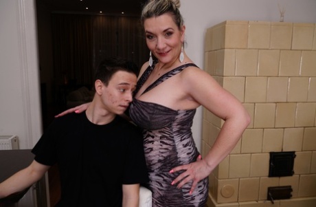 Big titted cougar seduces a young boy for hardcore sex in sleeveless dress