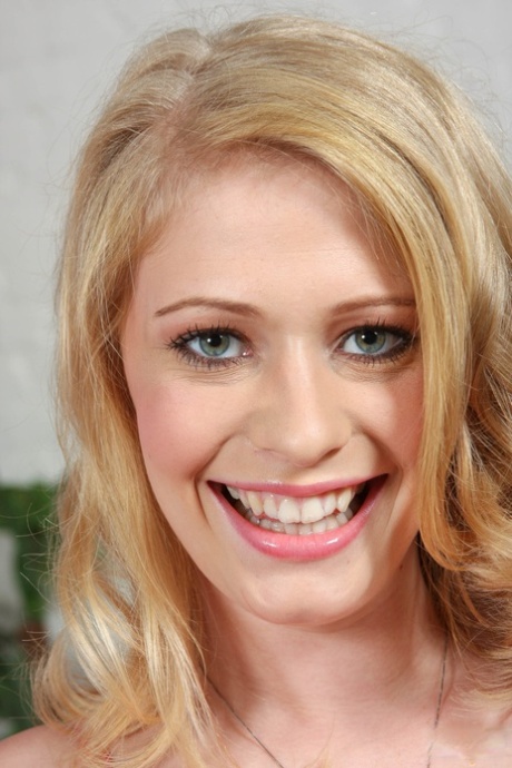 White girl with curly blonde hair get naked before tugging on a penis