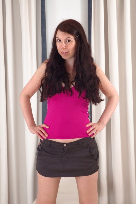 Brunette amateur Emily Winters unveils her great big tits and rubs her bush
