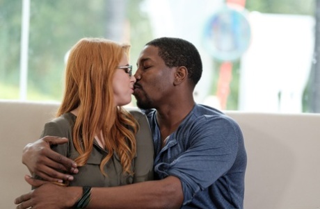Naughty redhead with large breasts Penny Pax gets banged by a black guy