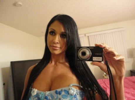 Black haired cougar Jewels Jade teases with her big tits before a cock ride