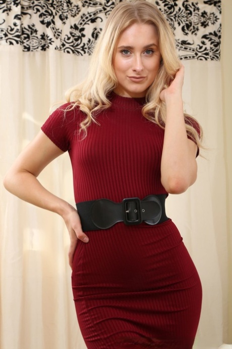 Blonde stunner in black stockings Amy K revealing her ass and small tits