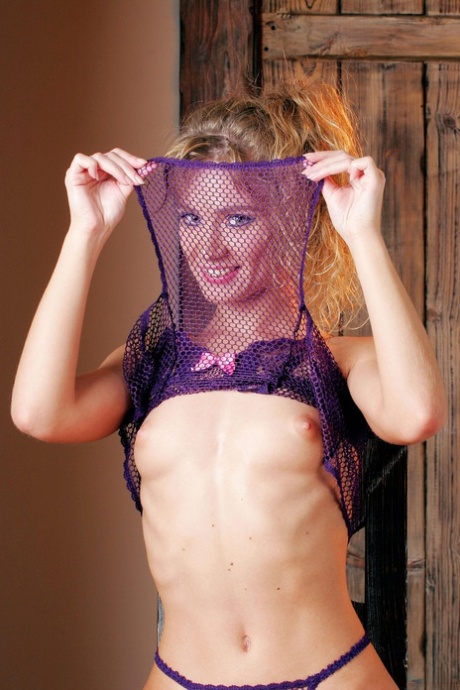 Glamorous Russian MILF Sandra C strips off her sheer lingerie and poses