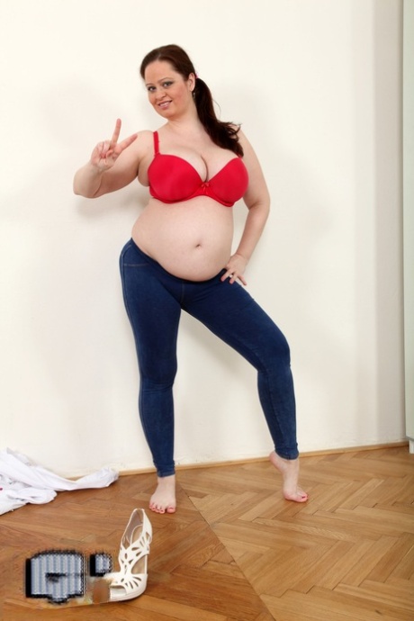 Brunette Czech MILF Sirale oils her big tits & her bulging pregnant tummy