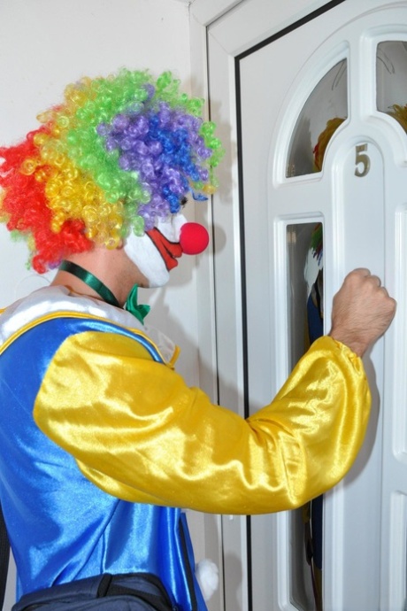 Tall MILF Lara strips for a clown before taking his knob deep on the floor