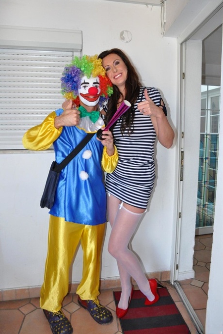Tall MILF Lara strips for a clown before taking his knob deep on the floor