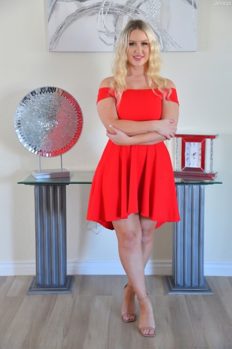 Amateur MILF Jenna hikes up her red dress and flaunts her incredible big tits
