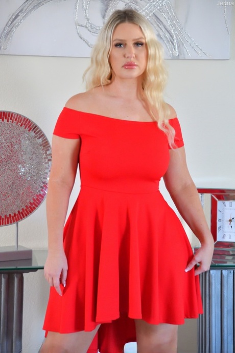 Amateur MILF Jenna hikes up her red dress and flaunts her incredible big tits