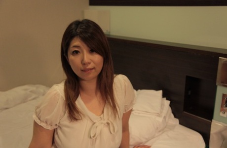 Curvy Asian MILF Naho Hazuki shows her gorgeous ass while getting banged