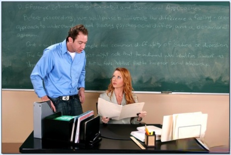 Redheaded teacher Janet Mason seduces a guy and gets fucked at school